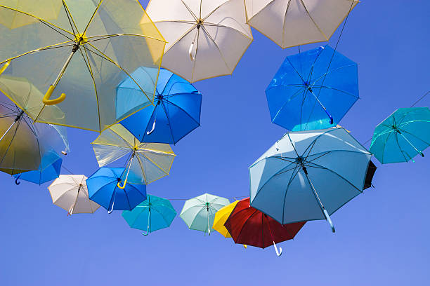 istock Colorful umbrellas with blue sky background 481407633