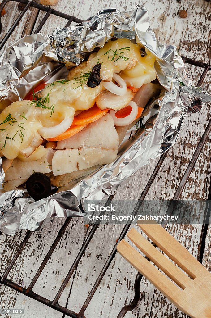 roasted fish roasted fish with vegetables in foil Cooking Stock Photo