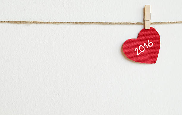 istock Red fabric heart with 2016 word hanging on the clothesline 481413650