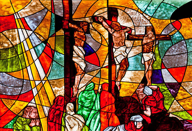Stained glass showing Jesus crucified stock photo