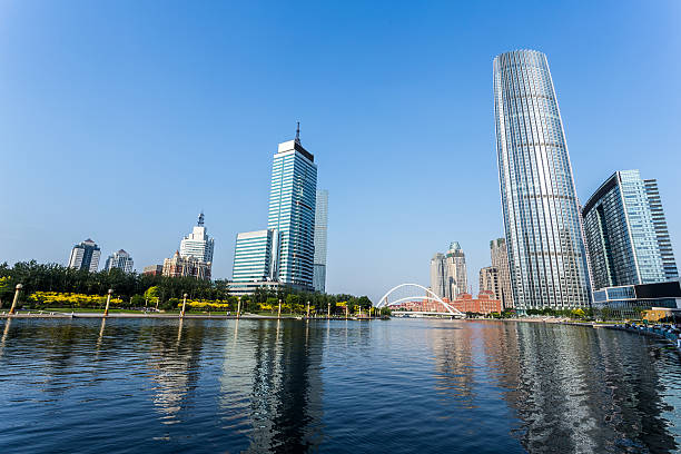 istock Modern buildings and river in urban city 481419990