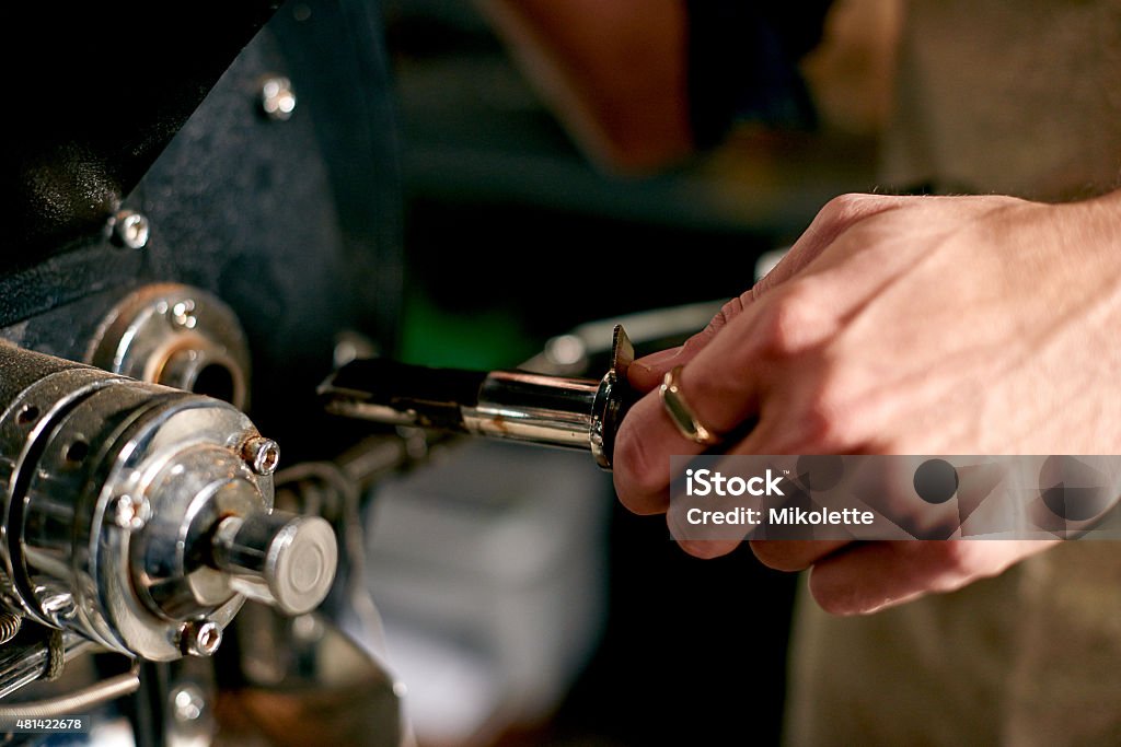 Fresh from the grinder Closeup shot of a barista preparing freshly ground coffee in a cafehttp://195.154.178.81/DATA/i_collage/pu/shoots/805311.jpg 2015 Stock Photo