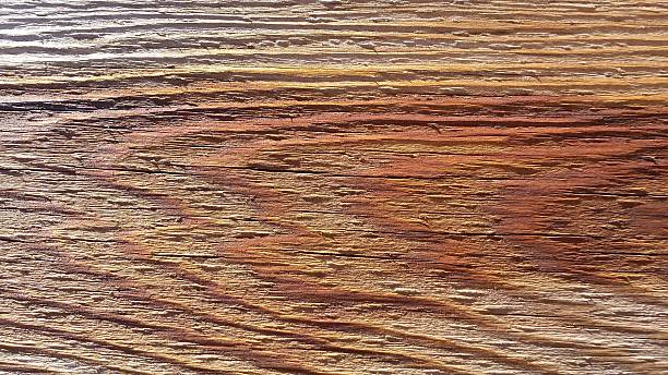 grano de tablón de madera de colores de fondo - brown curve knotted wood striped fotografías e imágenes de stock