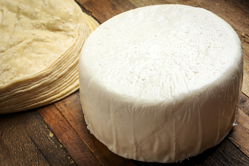 Cheese with a noble mold with lettuce leaves.