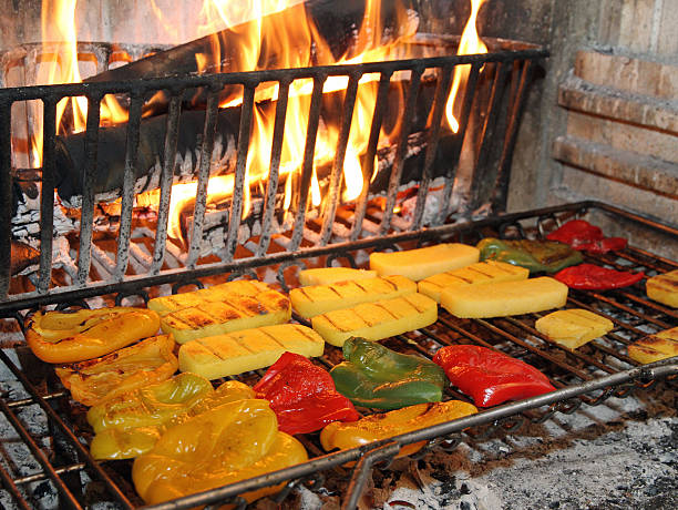 tasty yellow and red peppers grilled in a tavern fireplace