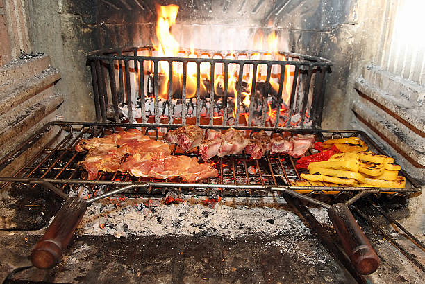 istock fire in the fireplace to cook meat and vegetables 481423879