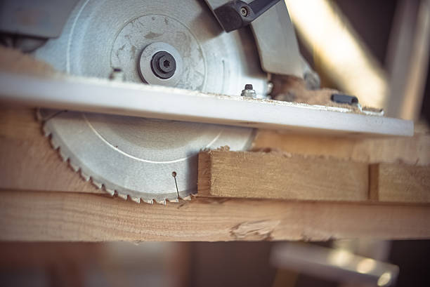 istock cutting wooden planks with electric saw construction 481426062