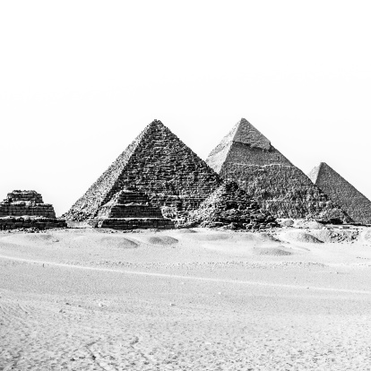 The pyramids of Giza, Cairo, Egypt;  the oldest of the Seven Wonders of the Ancient World, and the only one to remain largely intact. Black and white.
