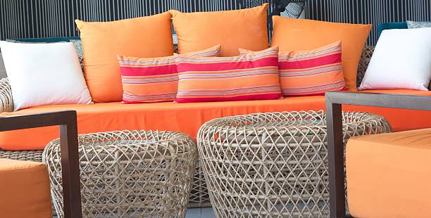 istock orange sofa with the colorful pillows 481428914
