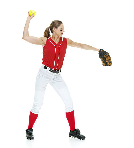 istock Female softball player throwing a ball 481429210