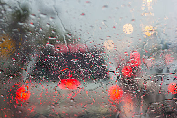 istock Blurry car silhouette seen through water drops 481431834