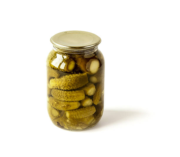 istock Salted cucumbers in a glass jar isolated on white 481432180