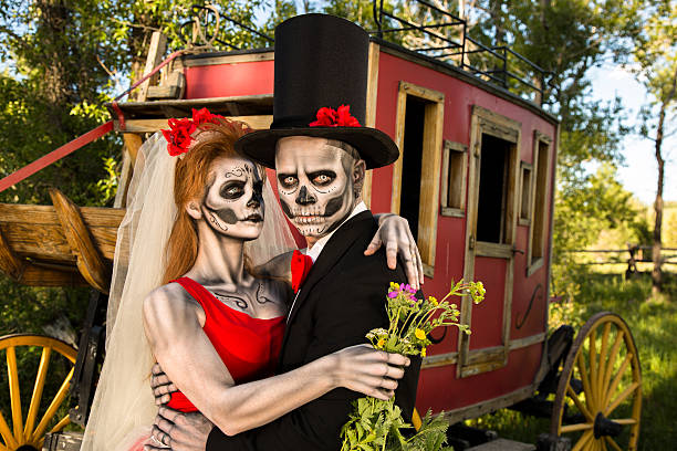 istock Characters: Skeleton bride wraps arms around groom. Spooky Halloween wedding. 481432223