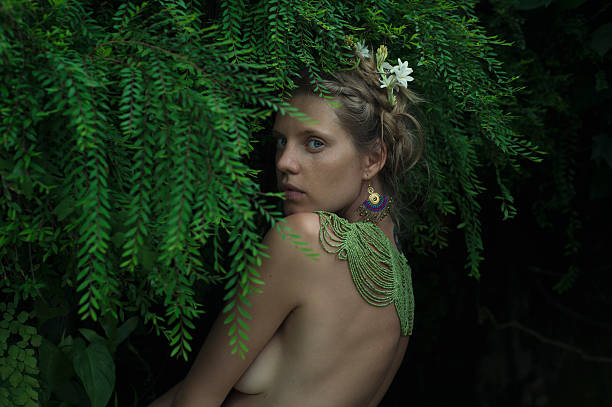 istock beautiful women in tropical leaves 481432883