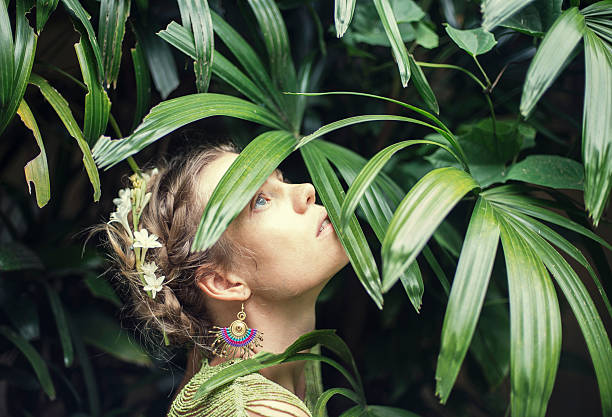 istock beautiful women in tropical leaves 481432919