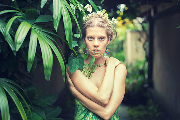 istock beautiful women in tropical leaves 481432927