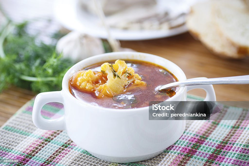 vegetable soup with cauliflower and beets vegetable soup with cauliflower and beets in soup bowl Beet Stock Photo