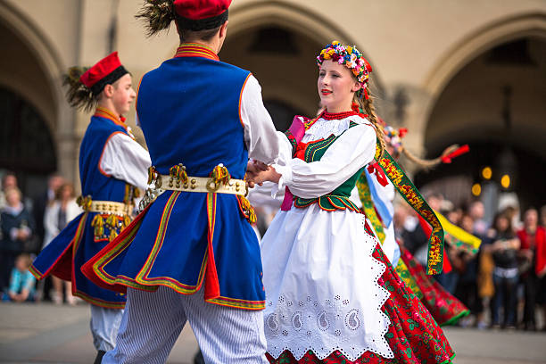 Krakow, Poland - May 3, 2015: Polish folk collective on Main square during annual Polish national and public holiday the Constitution Day - May 3, 1791 was adopted first Constitution of modern Europe.