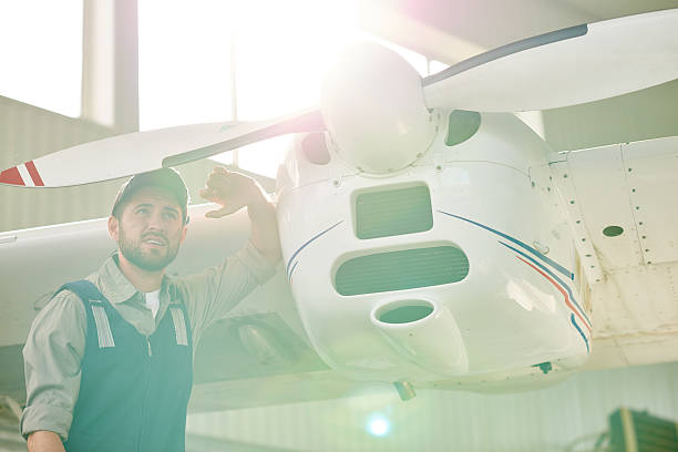 istock Mechanic near propeller airplane 481437048