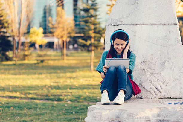 istock Girl in the park using tablet 481440116