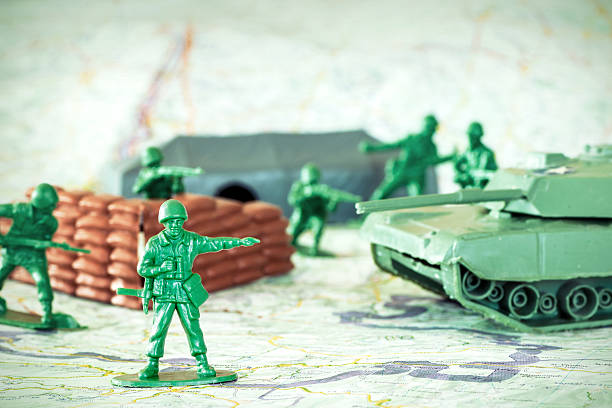 istock Leadership concept with little green armed soldier toy 481448274