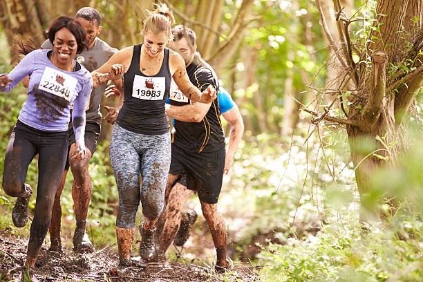 istock Competitors running in a forest at an endurance event 481448504