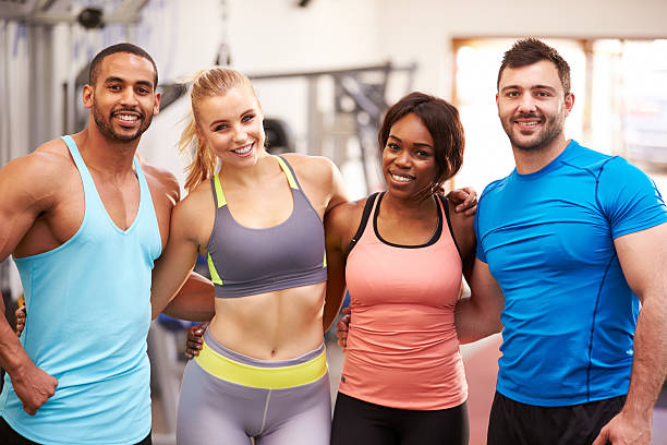 istock Group of gym buddies with arms around each other 481448578
