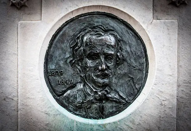 cast likeness of Edgar Allan Poe on his tombstone in Baltimore, MD