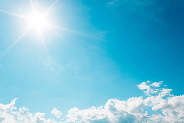 istock White Clouds on the blue sky with sun shines 481451214