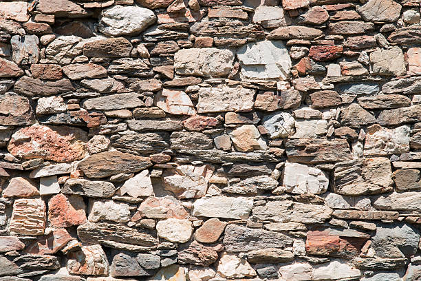 istock wall made of irregular shaped stones 481451366