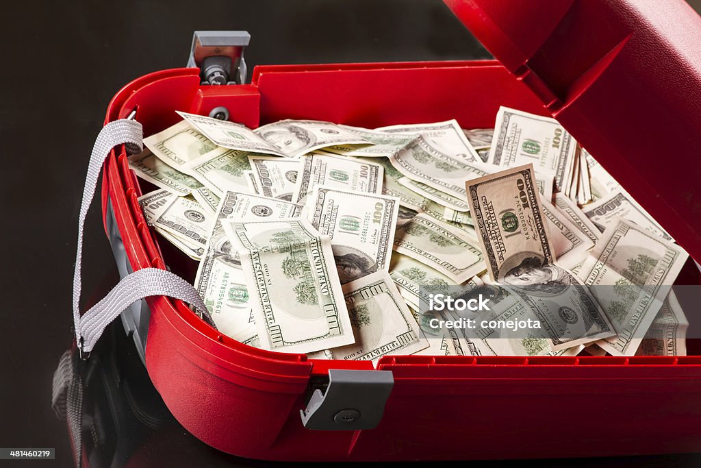 Suitcase with dollars A Suitcase with lots of dollars Briefcase Stock Photo