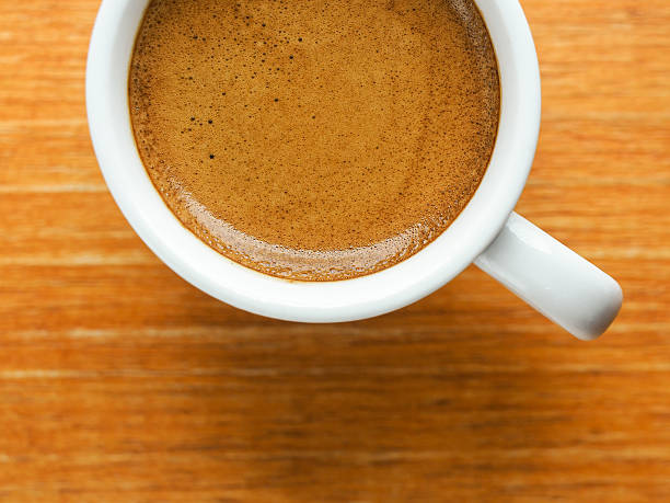 istock Cup of hot espresso coffee on wooden texture 481460442