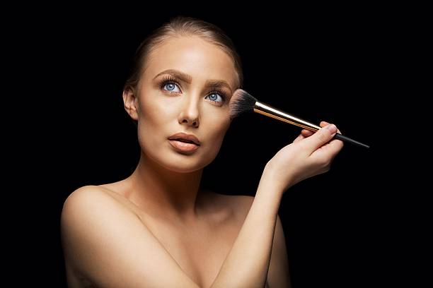 istock Beautiful woman wearing make up 481462989