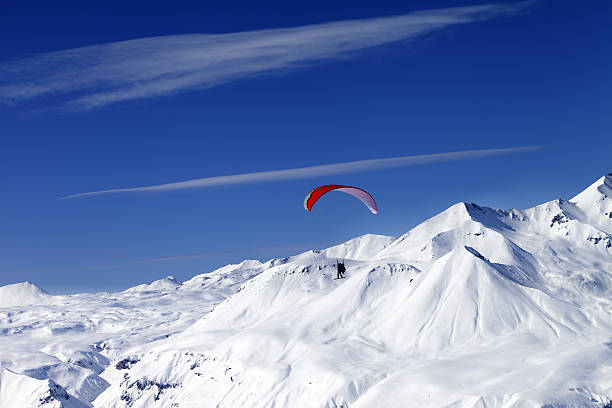 istock Sky gliding in snowy mountains at nice sun day 481465109