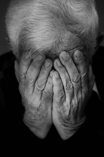 istock Hands covering face of old man 481466068