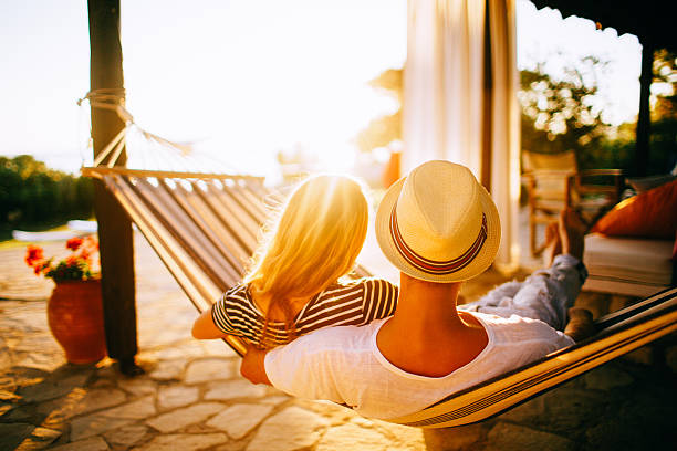 istock Couple relaxing in a hammock 481466608