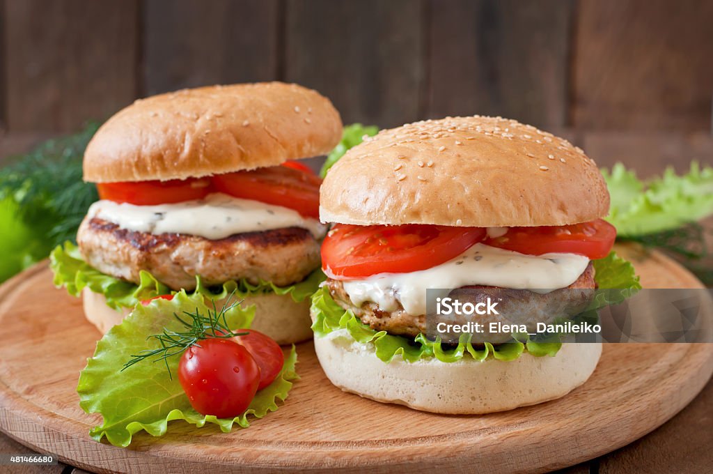 Appetizing hamburger with chicken burger and sauce Tartar 2015 Stock Photo