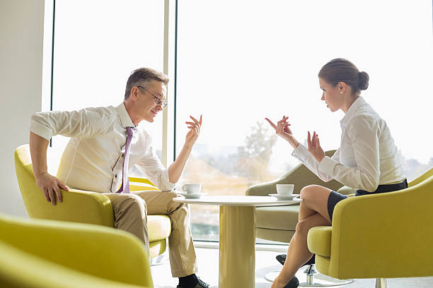 istock Side view of business people conversing at lobby 481467229