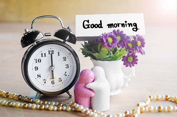 istock Flowers in a ceramic pots with purple vintage alarm clock. 481470912