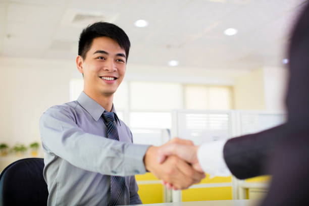 istock business man hand shaking in office 481474400
