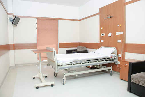 Empty gurney at a hospital room - healthcare and medicine concepts