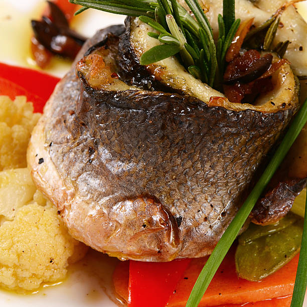 istock Sea bass fillet with spring vegetables 481478890