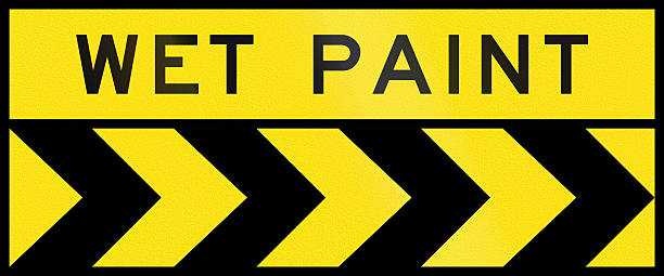 Chevron Alignment To The Right - Wet Paint In Australia Australian chevron alignment pointing to the right with the words: Wet paint freshly painted road markings stock pictures, royalty-free photos & images