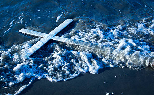 Wash Up White Cross White cross that has been wash up on a beach. baptism stock pictures, royalty-free photos & images