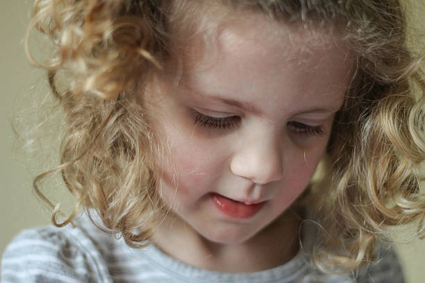 istock Little girl with curly hair 481483487