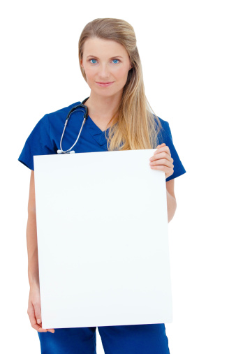 Portrait of a  smiling young Doctor holding a blank sheet of paper on white to write your text. Isolated on a white background. Copy space.