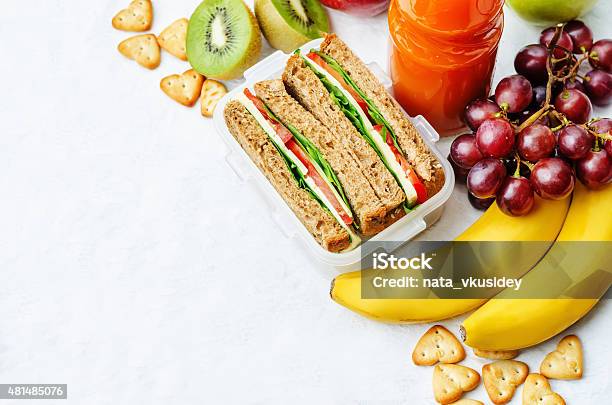 School Lunch With A Sandwich Fresh Fruits Crackers And Juice Stock Photo - Download Image Now