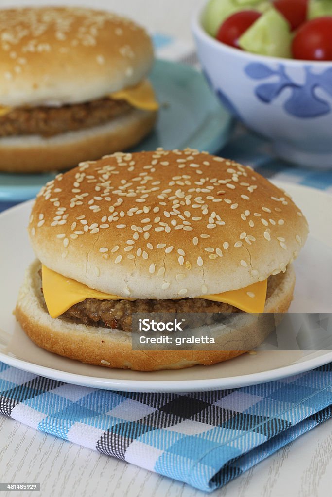 Cheeseburgers with green salad Beef Stock Photo