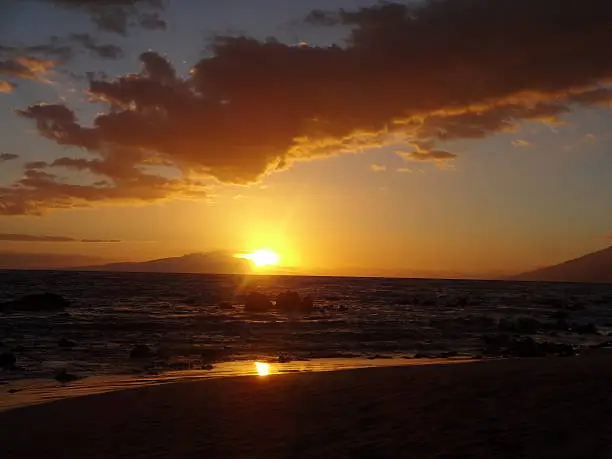 View of the sun setting from Waikiki Beach, Hawaii