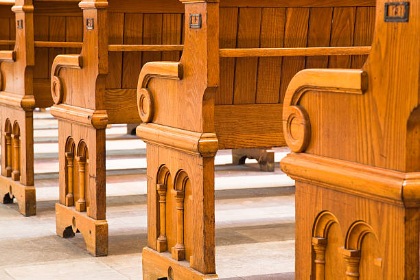 istock Old oak church pews 481489691